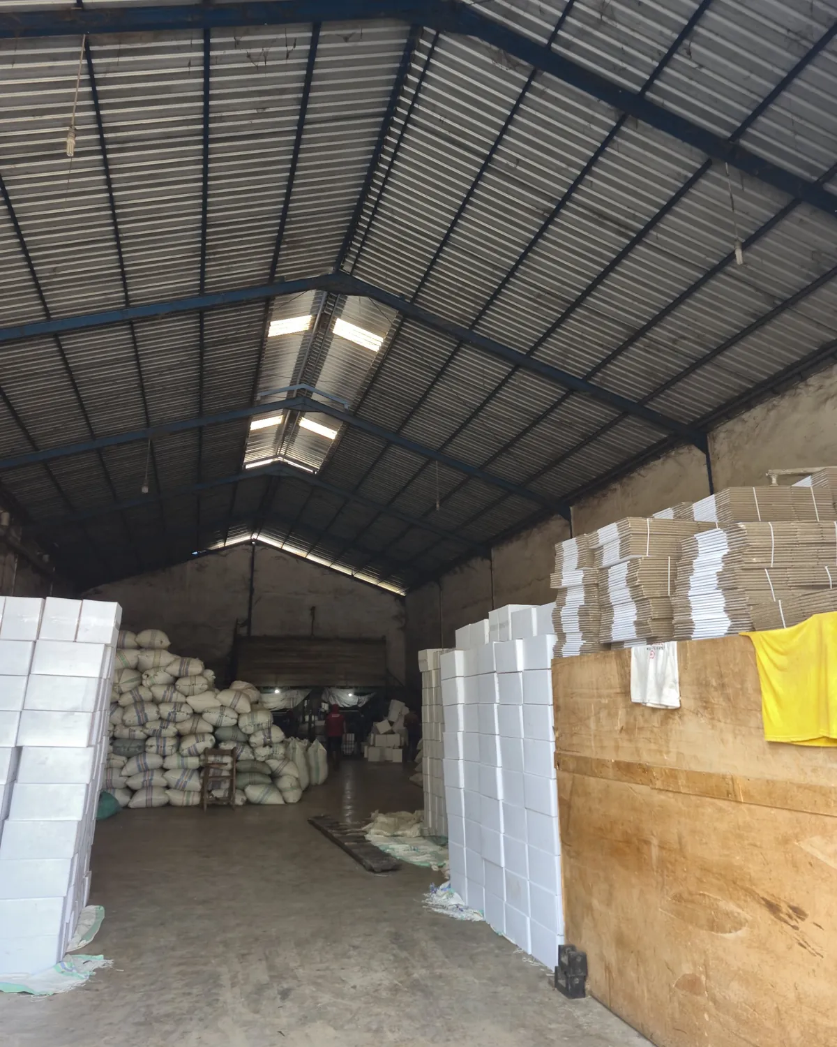 Bagged stock and packing cartons inside the warehouse